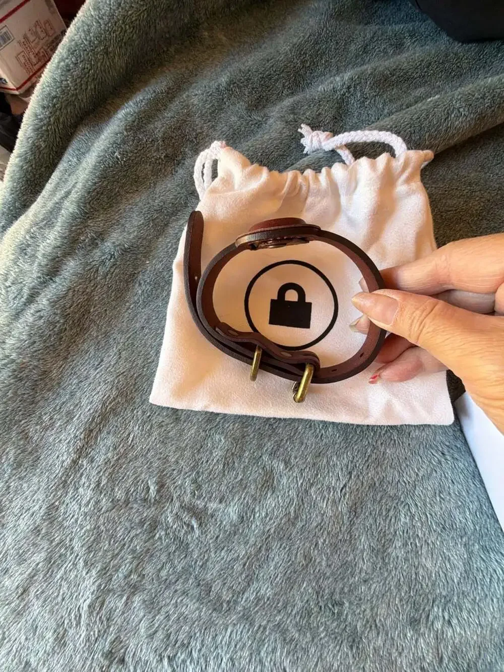 TagLock Leather AirTag Collar Holder Brown with a TrackR bravo device